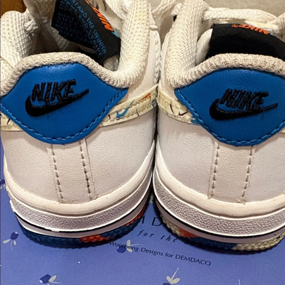 Nike Kids White Low-Top Sneakers with Multicolor Swoosh Accent